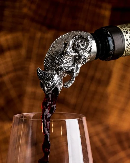 Red wine pouring through a sculptural stainless steel Menagerie wine pourer